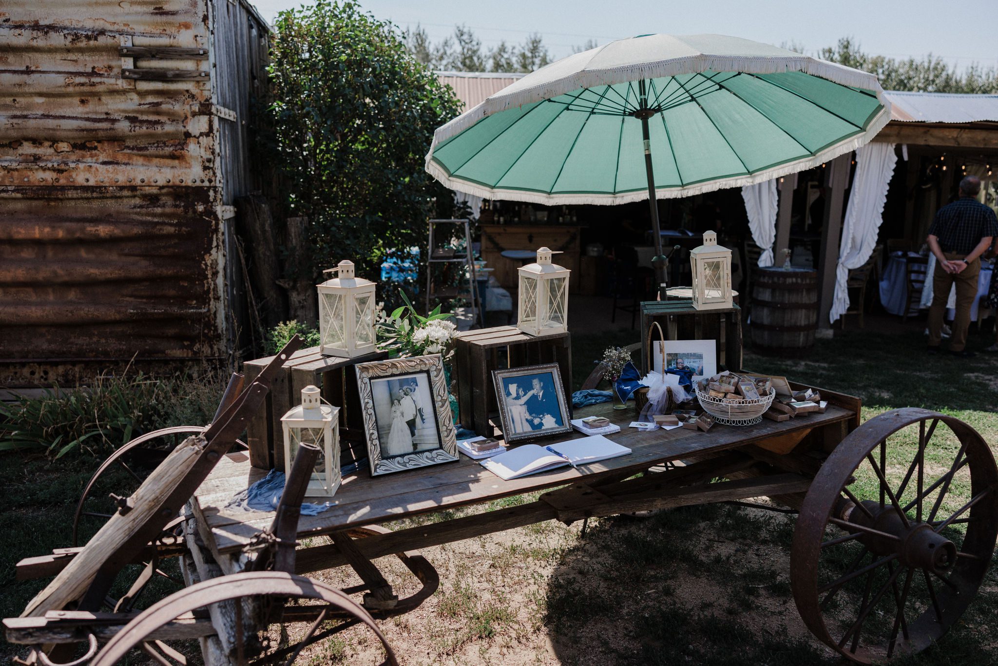 a rustic table set up with decor and old photos are set up for wedding reception in colorado