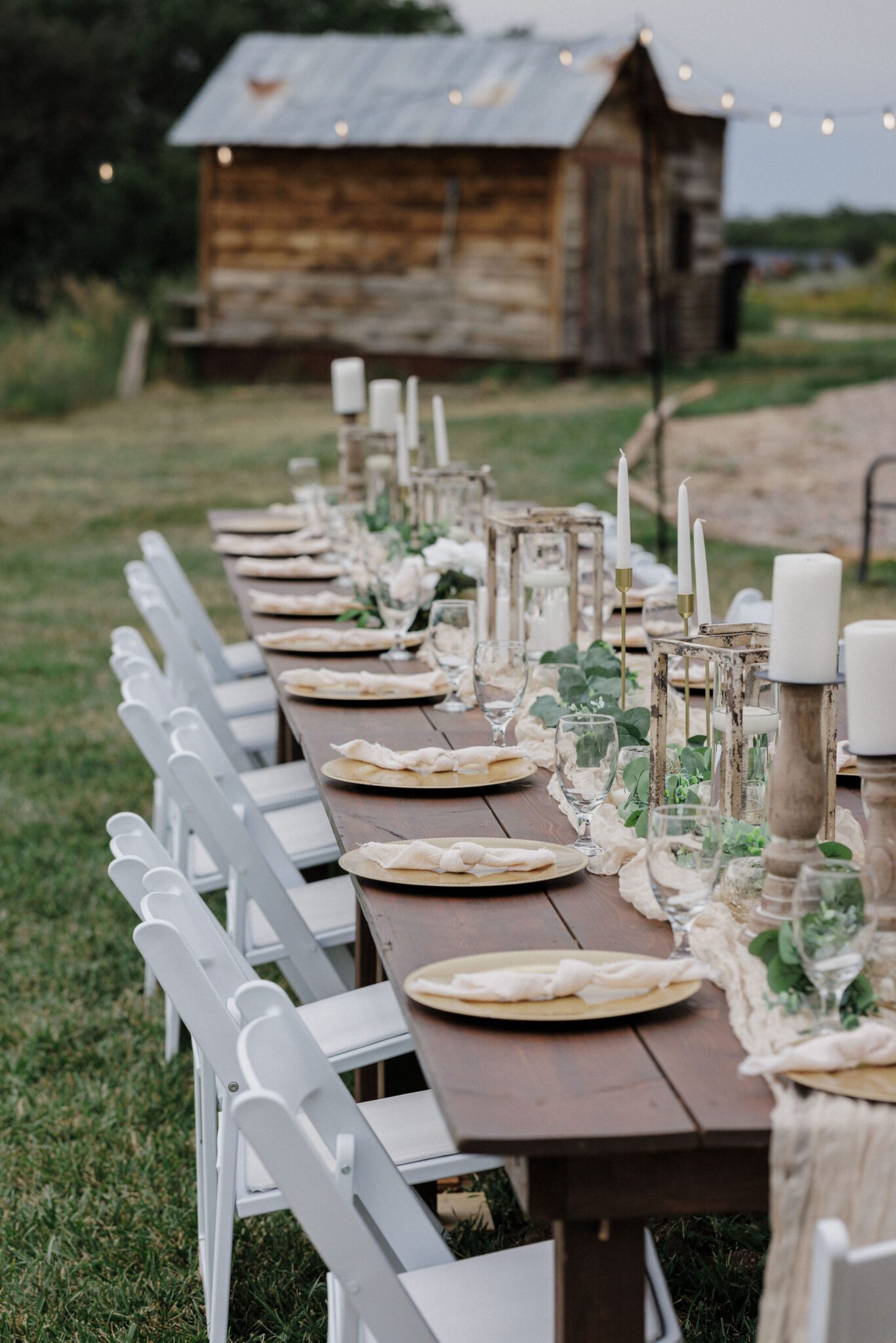 a long family style table is set up for a rustic wedding at a colorado airbnb