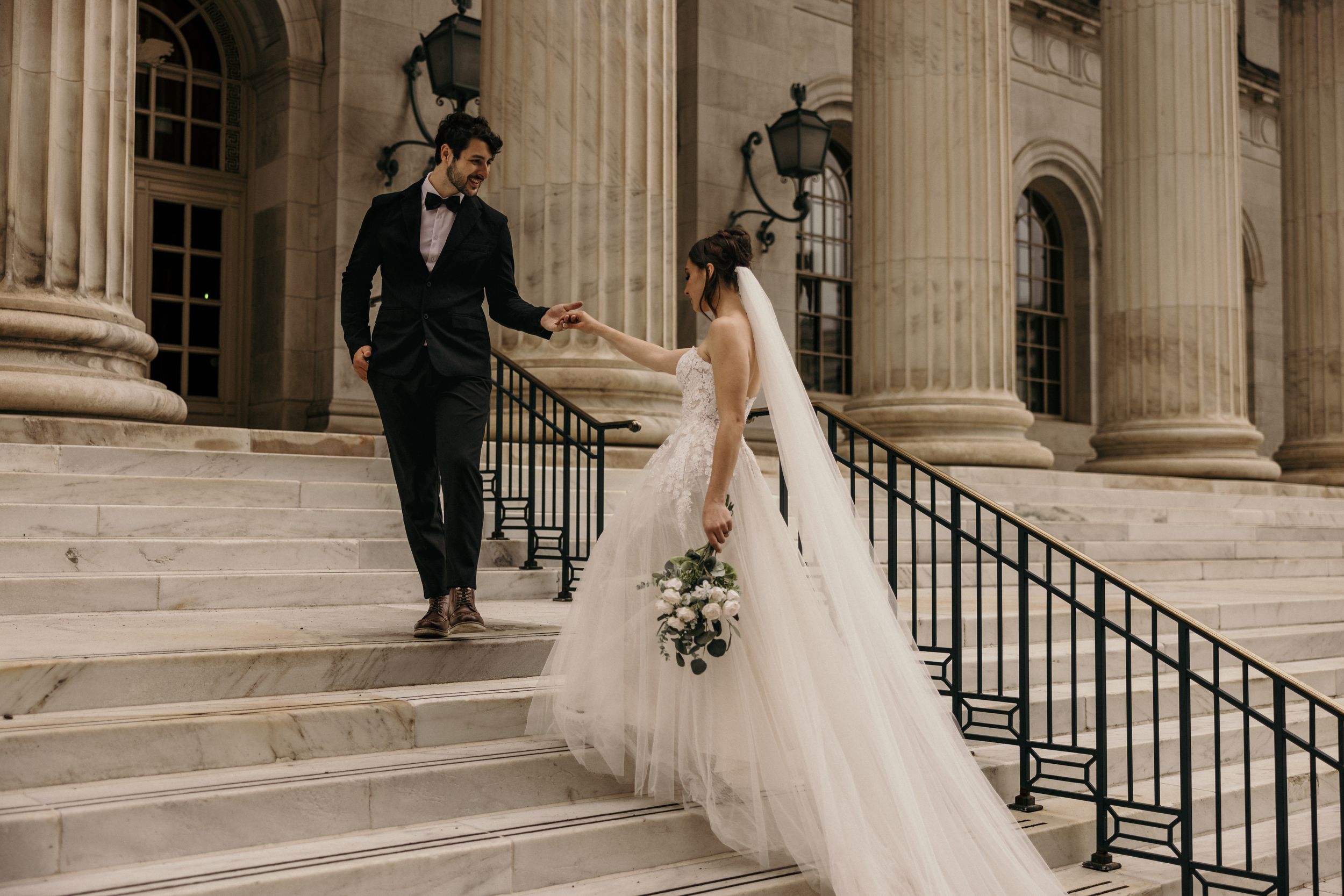 bride and groom on steps during byron white courthouse wedding portrait session.