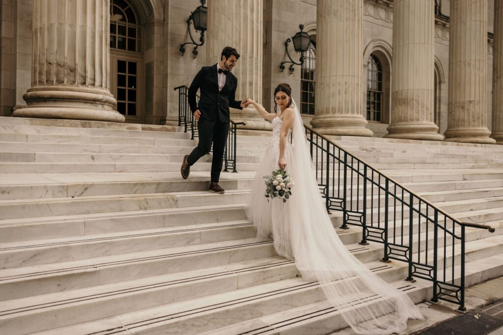 bride and groom on steps during byron white courthouse wedding portraits.