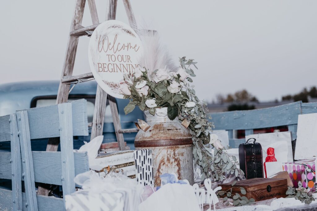 Wedding details in the back of an old blue farm truck during rustic western wedding photos.