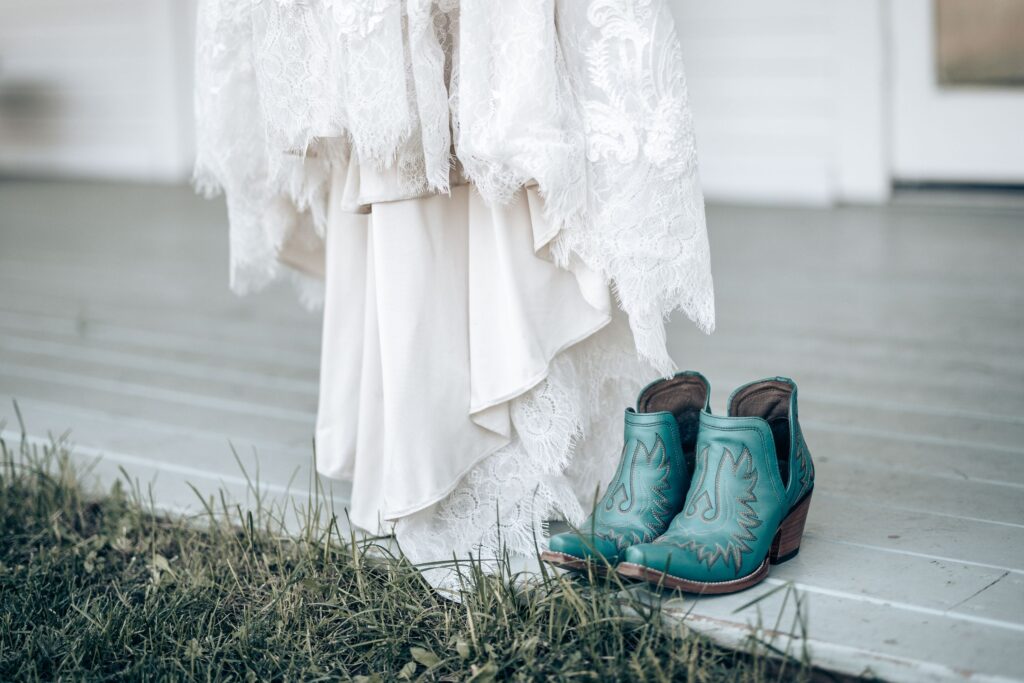teal boots and wedding dress photo during a rustic colorado wedding.