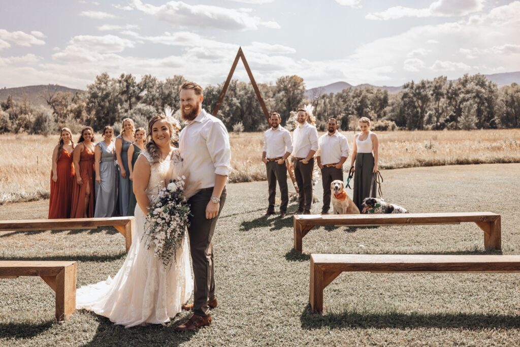 bride, groom, and wedding party stand for photo by colorado elopement photographer.