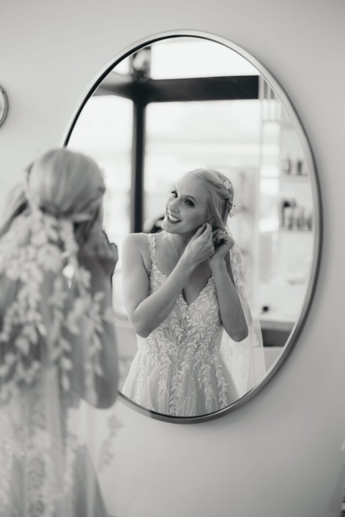 black and white image of bride getting ready for her colorado springs wedding.