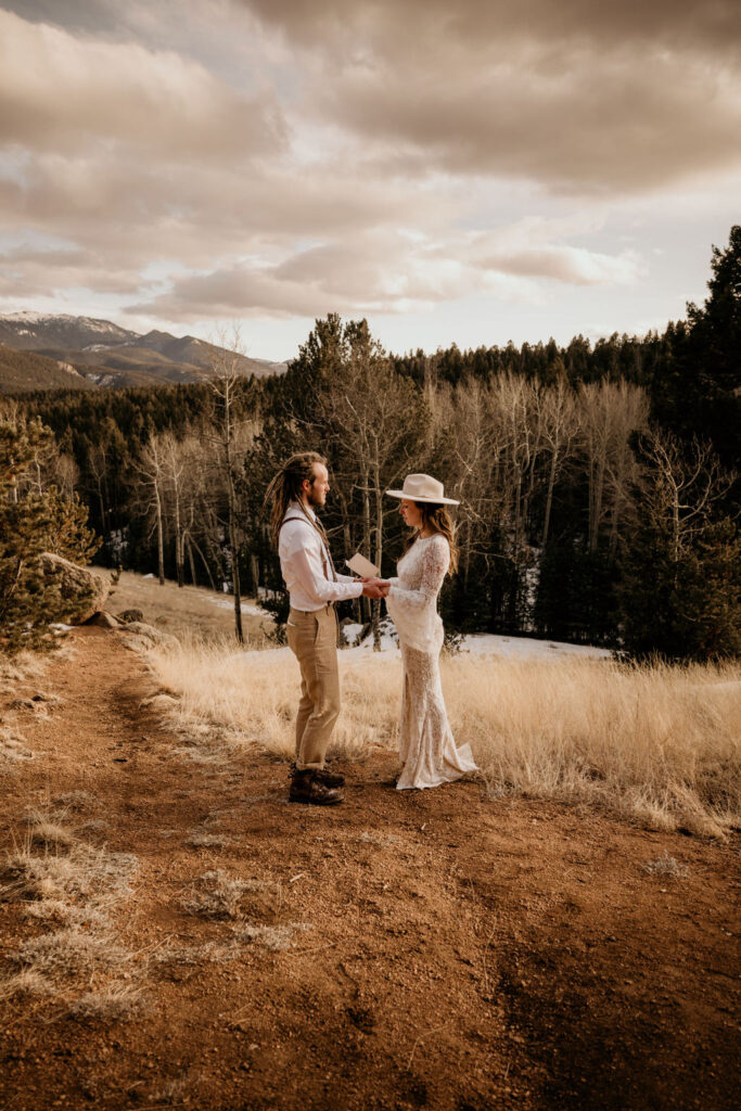 Bride and groom say self-written vows during colorado adventure elopement.