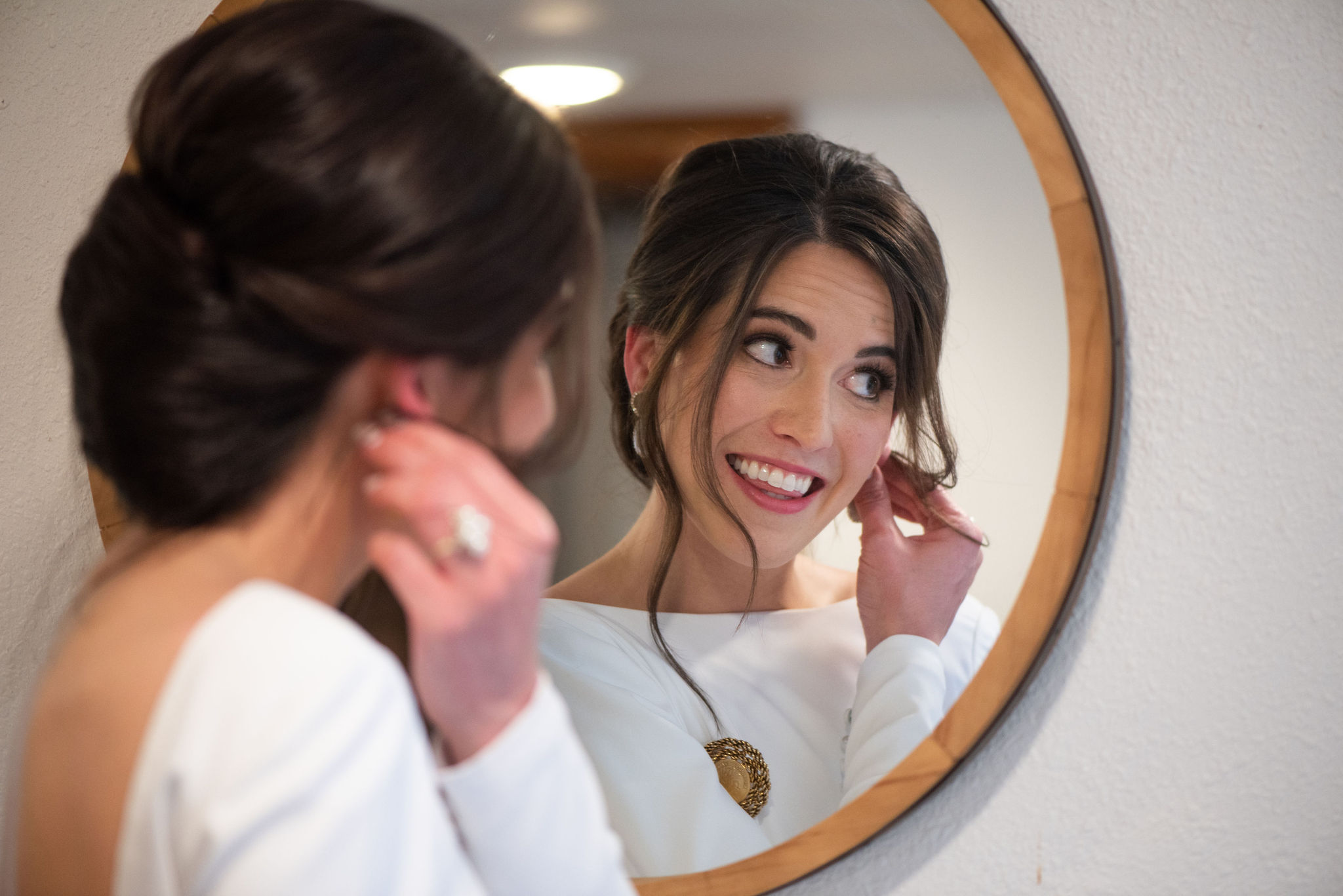 bride gets ready for her colorado micro wedding at river bend wedding venue.