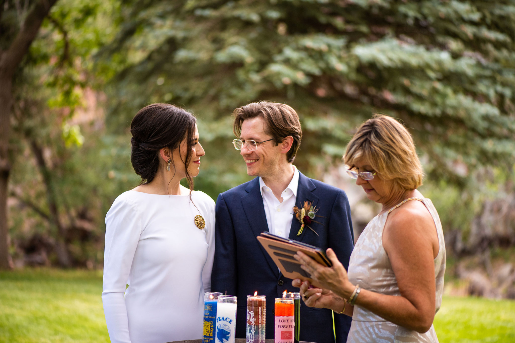 bride and groom do an intention setting ceremony at their colorado micro wedding at river bend venue.