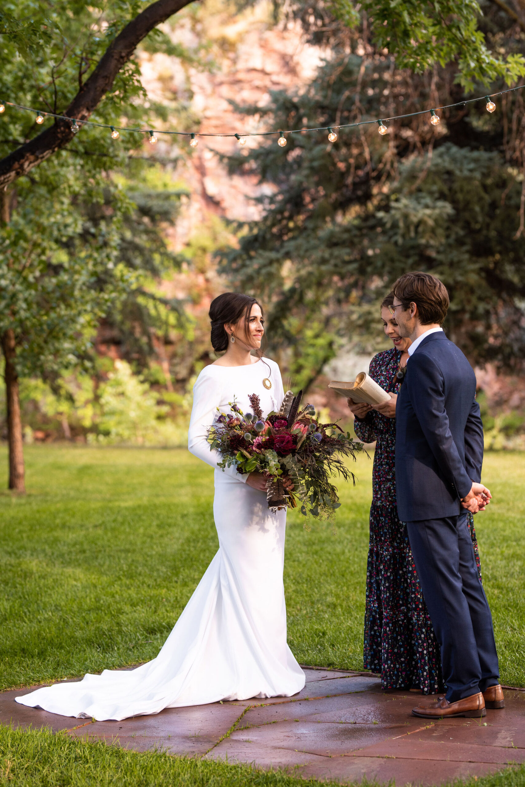 bride and groom during their micro wedding ceremony at river bend venue in lyons colorado.