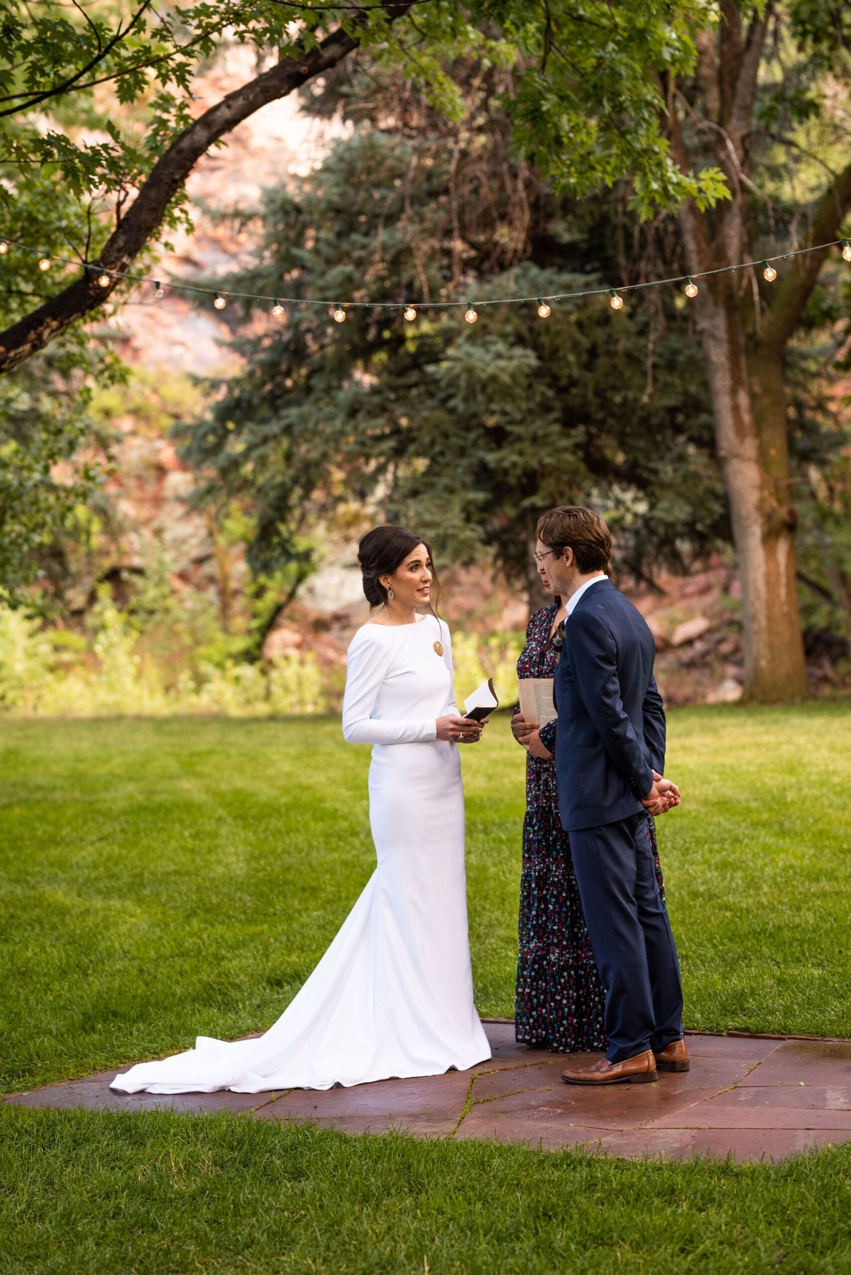 bride and groom during their micro wedding ceremony at river bend venue in colorado.
