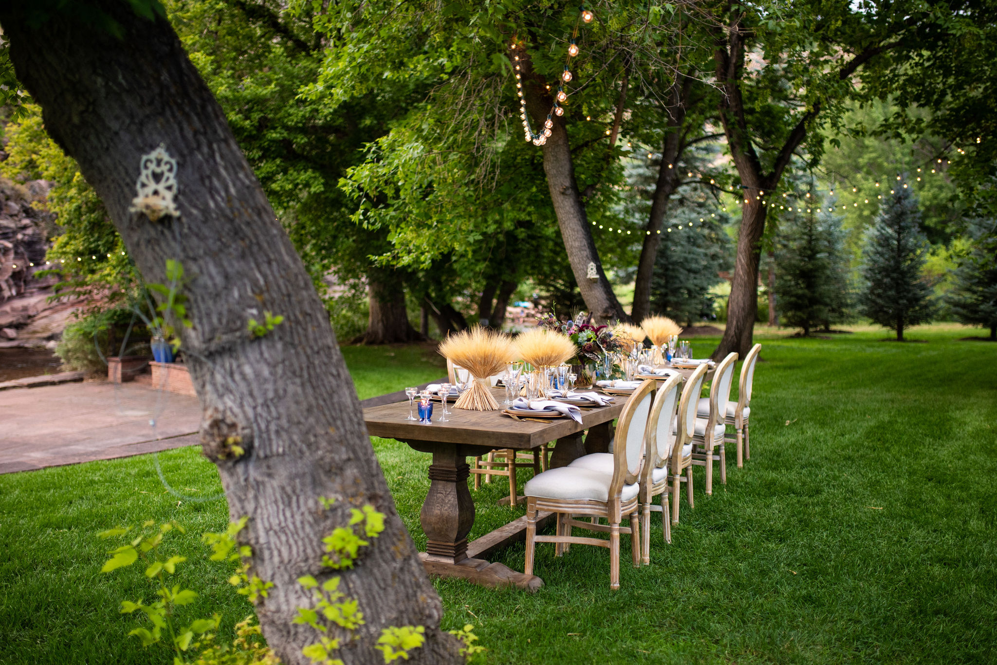 wedding dinner table set up at river bend wedding venue in lyons colorado.