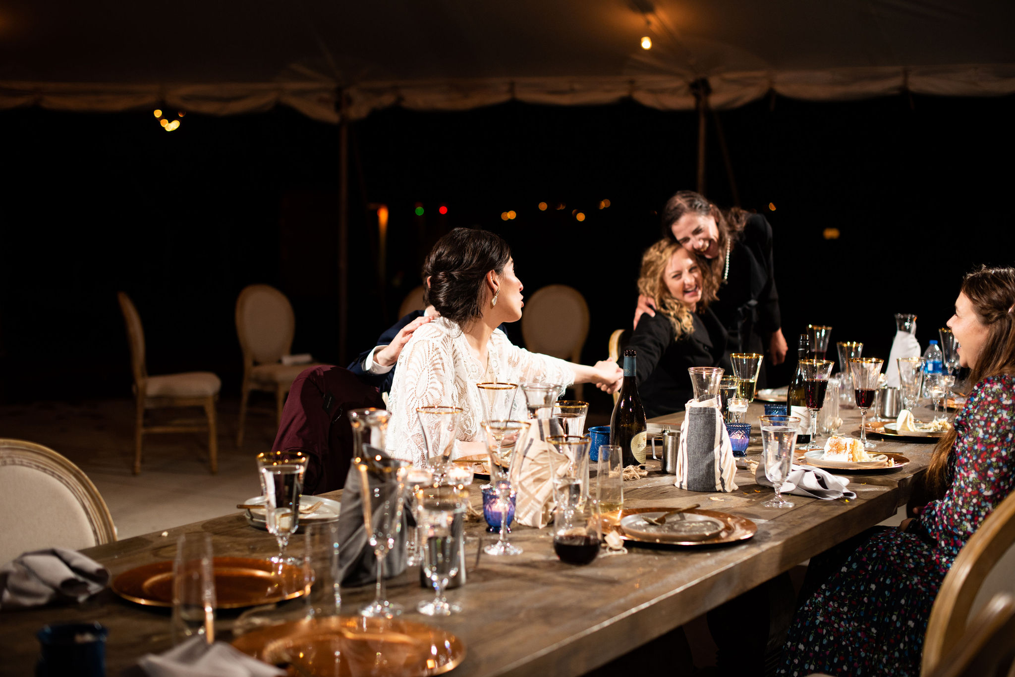 bride and groom enjoy dinner with their guest during colorado micro wedding at river bend.