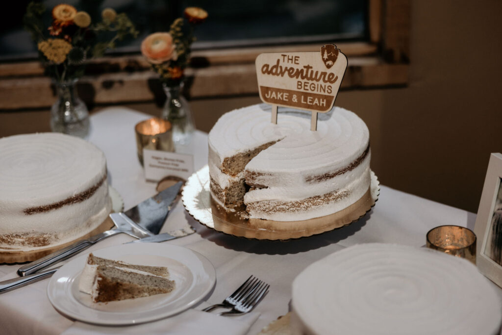 colorado micro wedding photographer takes photo of wedding cake at black mountain lodge.