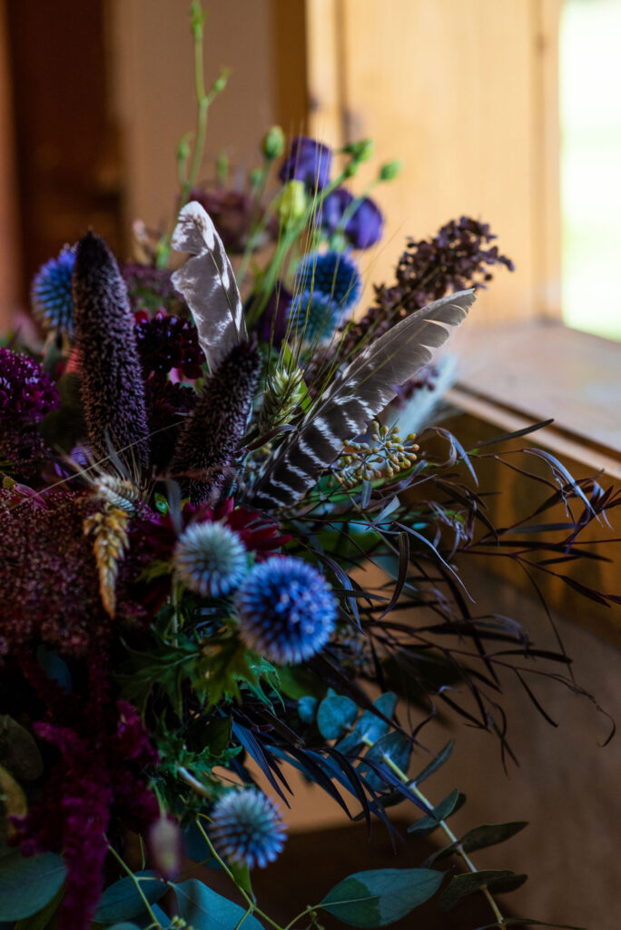 vibrant wedding florals by Plume and Furrow for a colorado micro wedding at river bend venue.