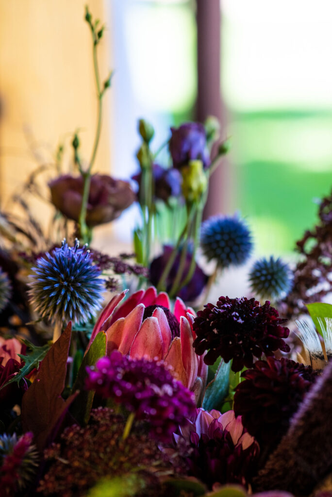 close up image of vibrant floral arrangement by Plume and Furrow for a colorado micro wedding. 