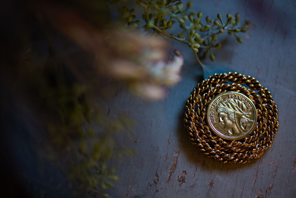 close up image of brides brooch for her colorado micro wedding.