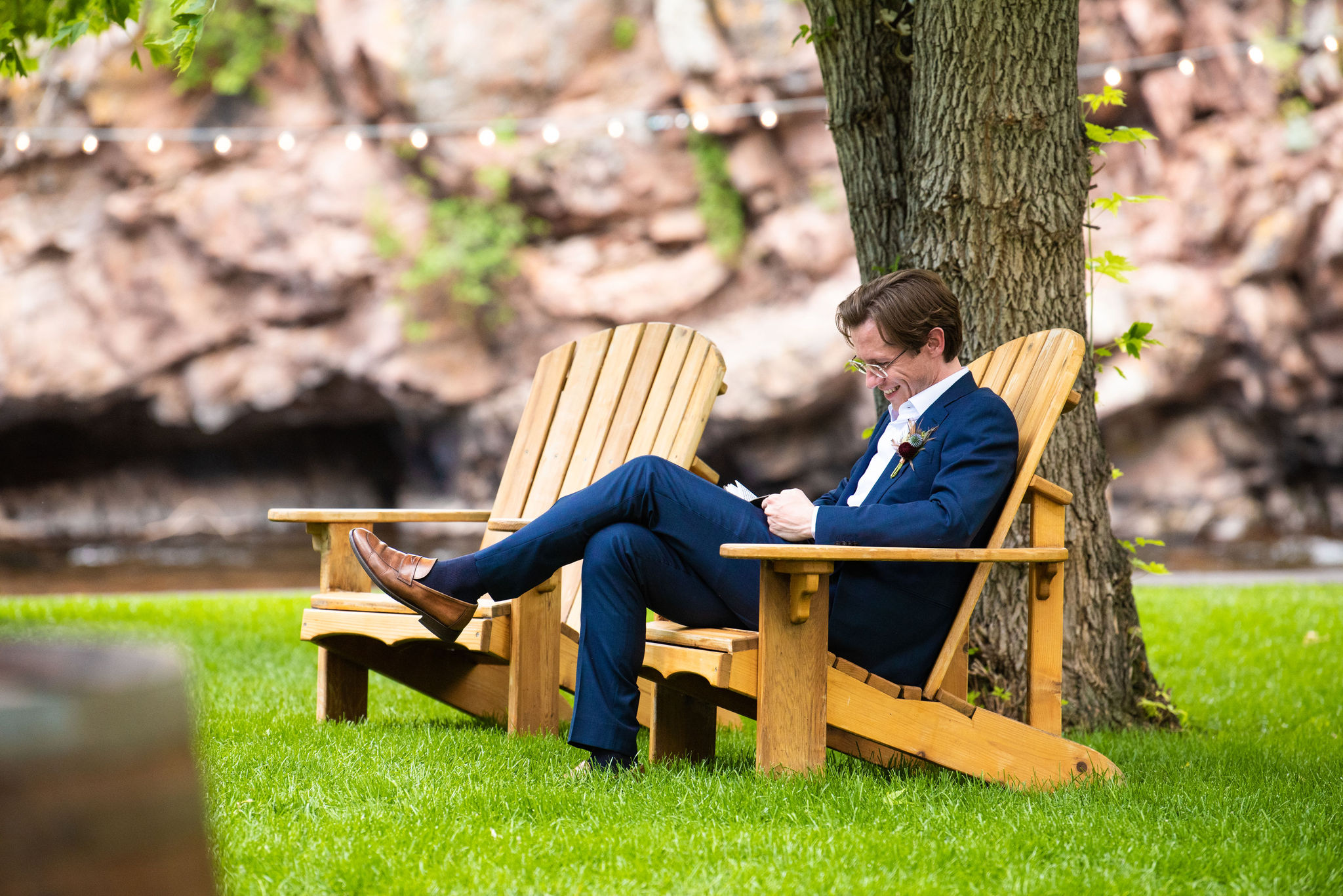 groom swrites down vows during micro wedding at river bend venue in lyons colorado.