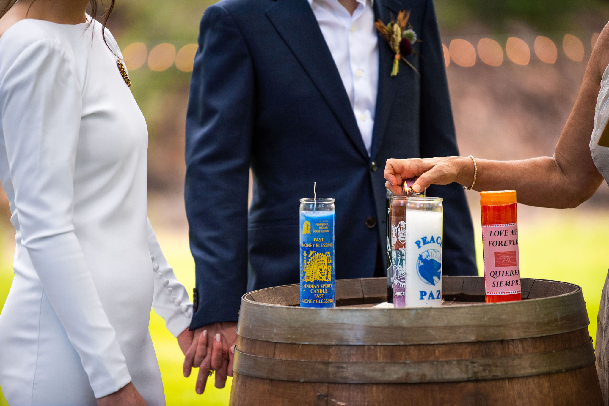 bride and groom do candle ceremony at their micro wedding at river bend in lyons colorado.