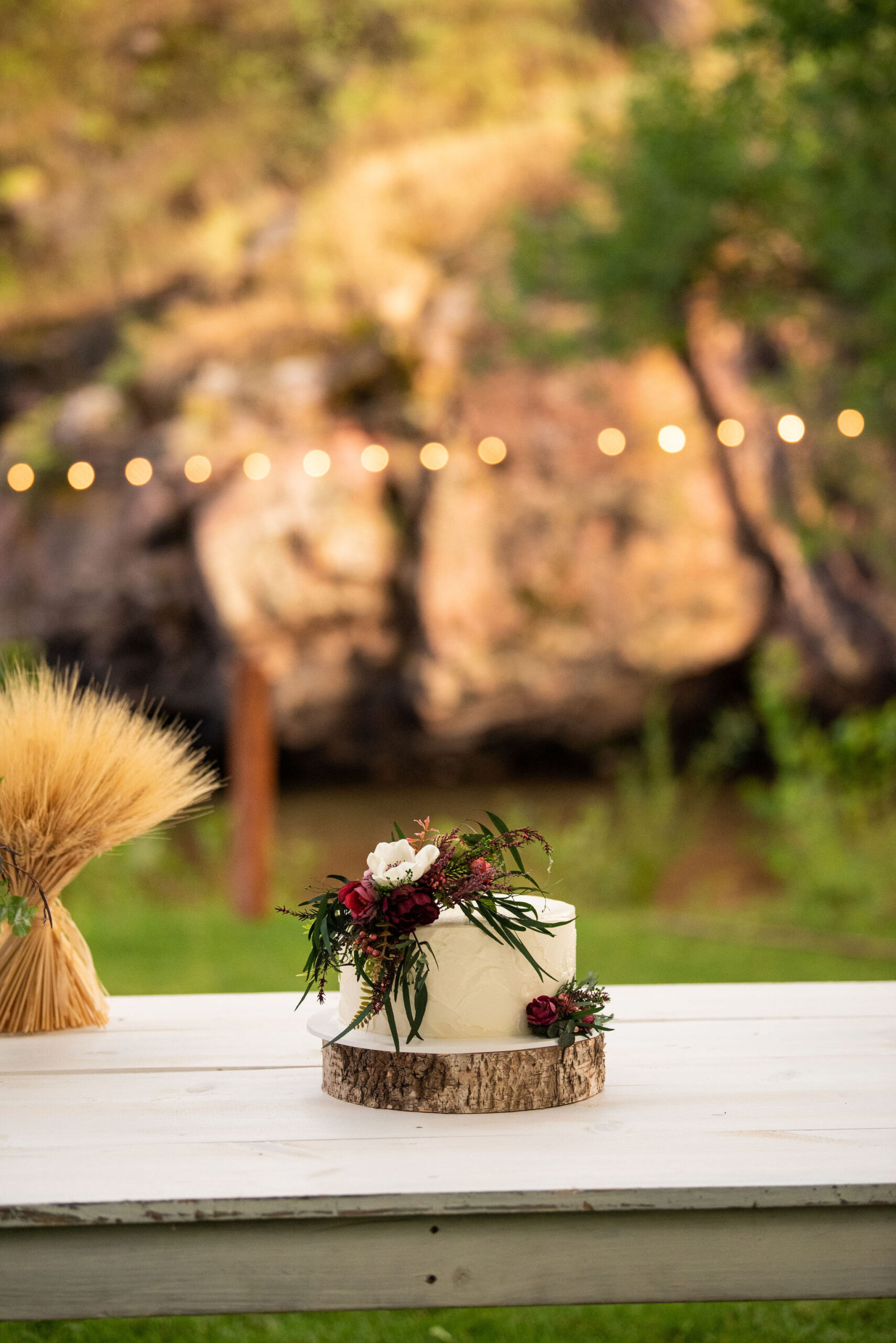 cake with floral details made by The Makery for a colorado micro wedding at river bend.