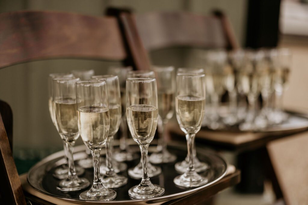 glasses of champagne are on a tray during a mountain top micro wedding reception in colorado.