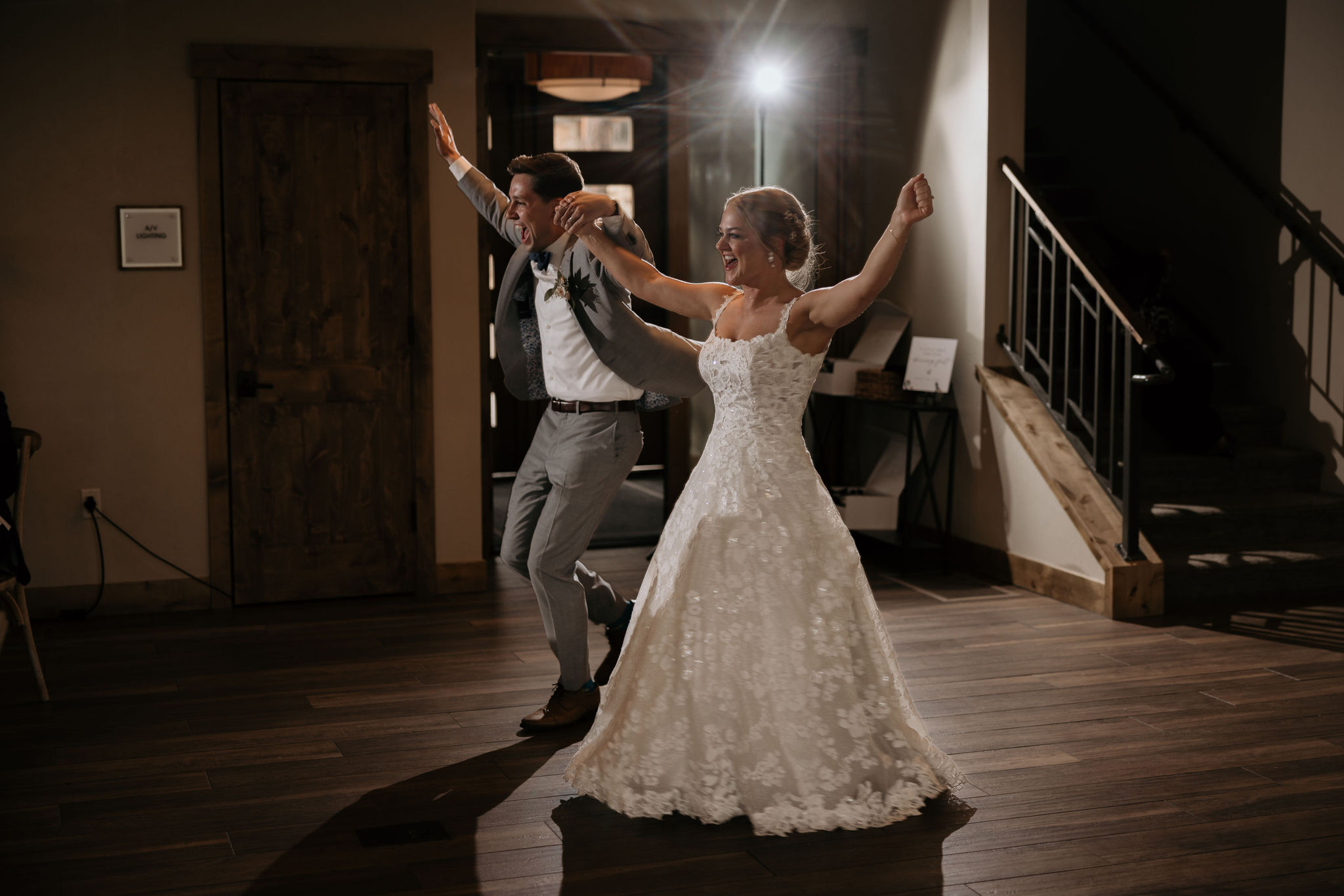 bride and groom walk in to wedding reception at skyview venue in colorado.