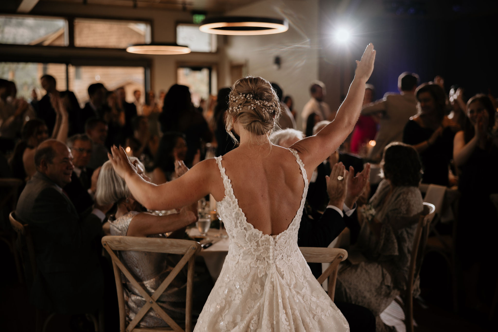 bride dances at wedding reception at skyview venue in estes park colorado.