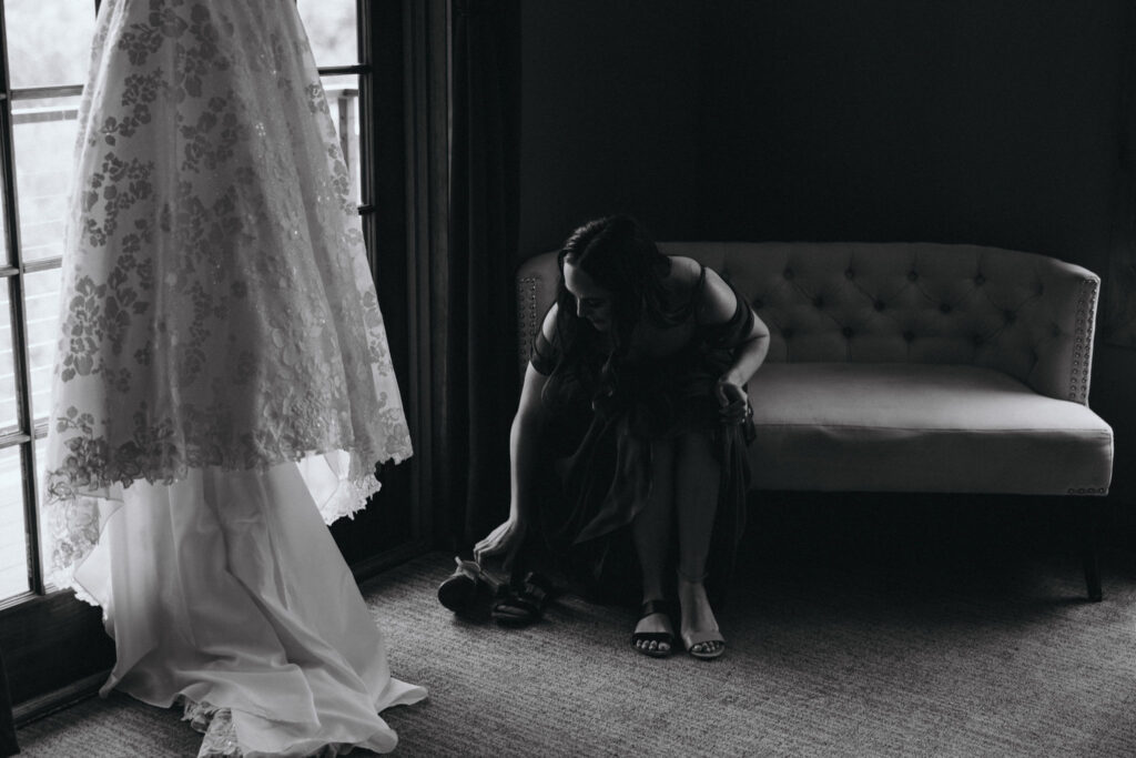 wedding dress hangs in bridal suite during colorado wedding at skyview.