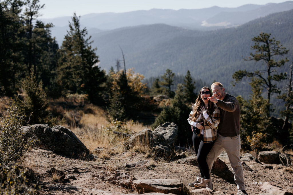 man points out colorado photographer to fiancee after surprise proposal.