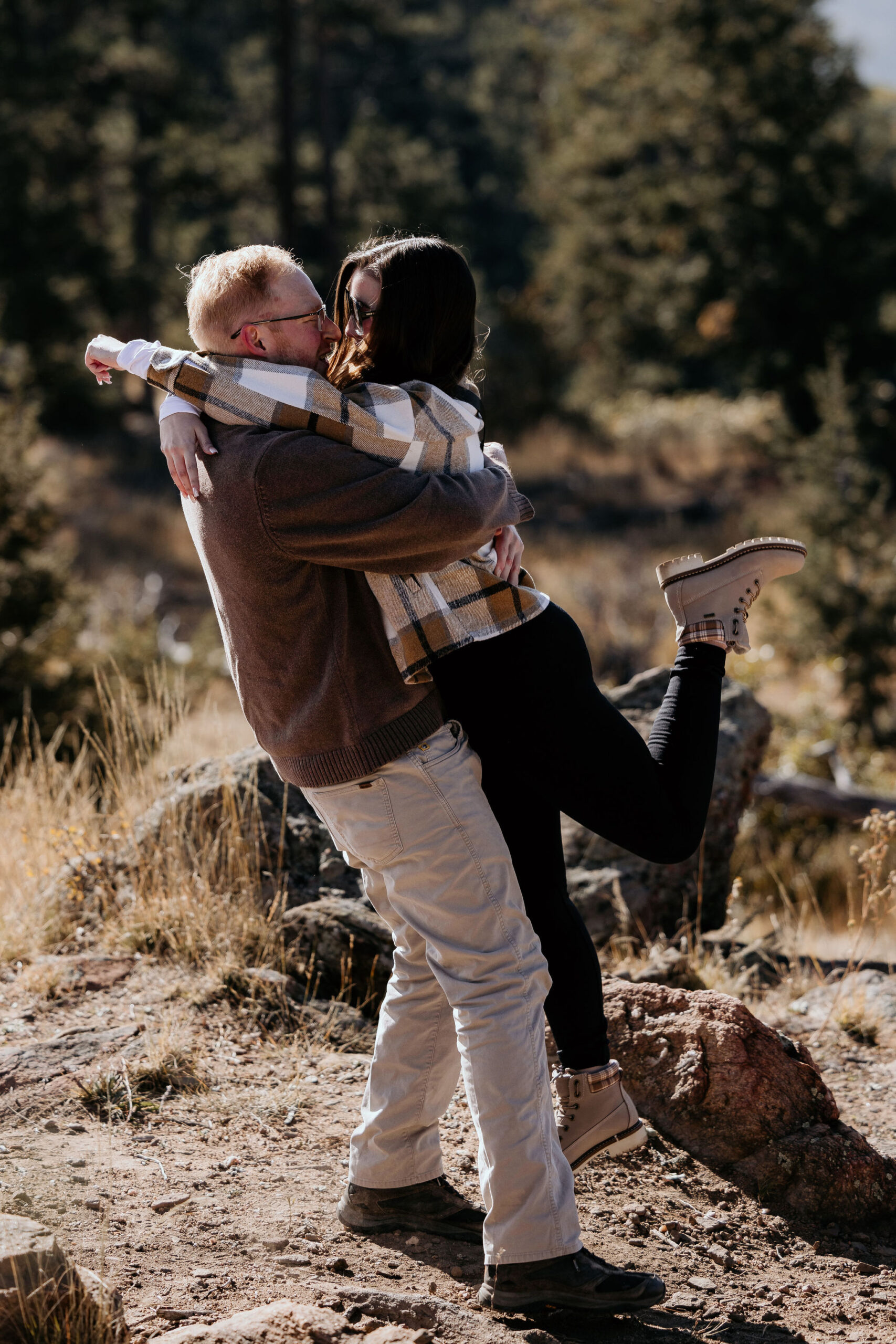 woman jumps into mans arms after he proposed.
