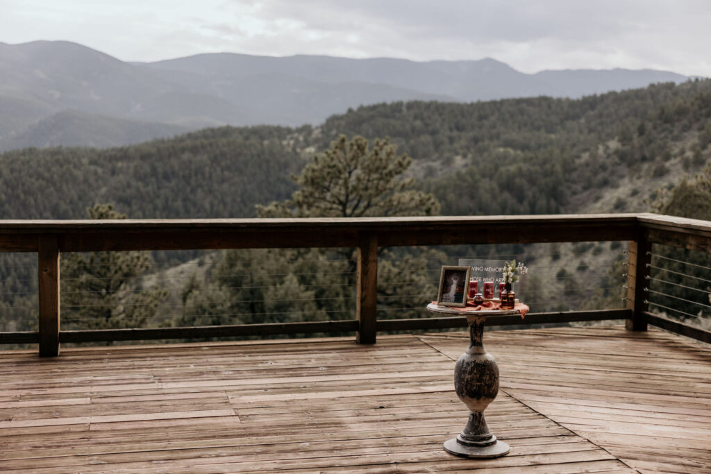 memorial table set up on airbnb wedding venue deck in colorado.