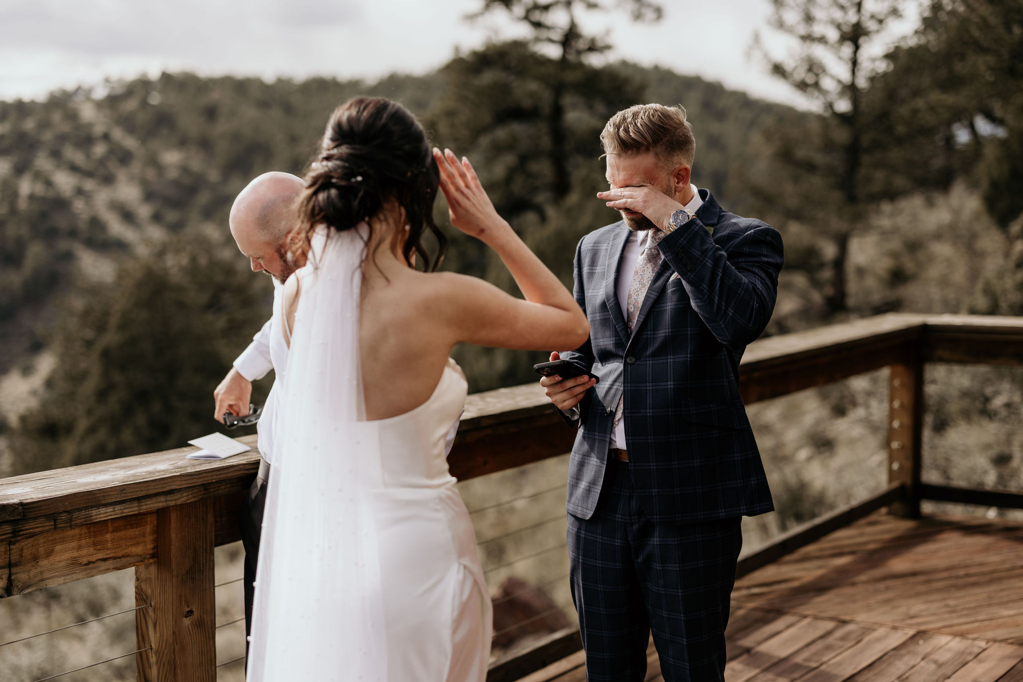 groom cries as he reads his self-written vows.