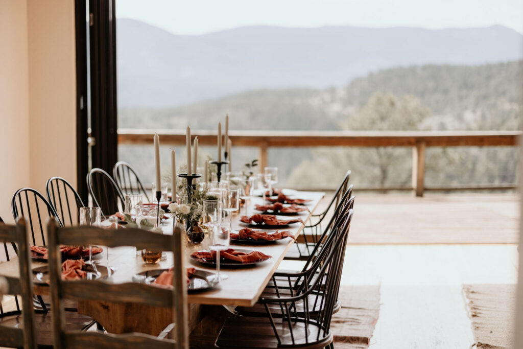 family-style table set up overlooking the colorado mountains during an airbnb micro wedding.