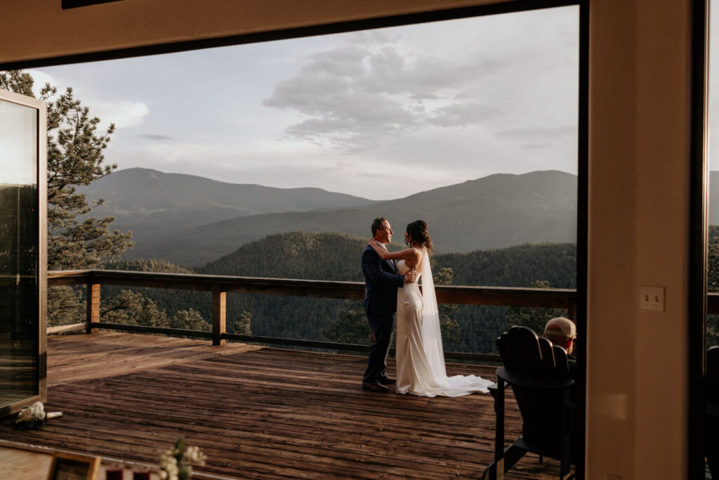 bride has a father daughter dance at a colorado airbnb during her microwedding.