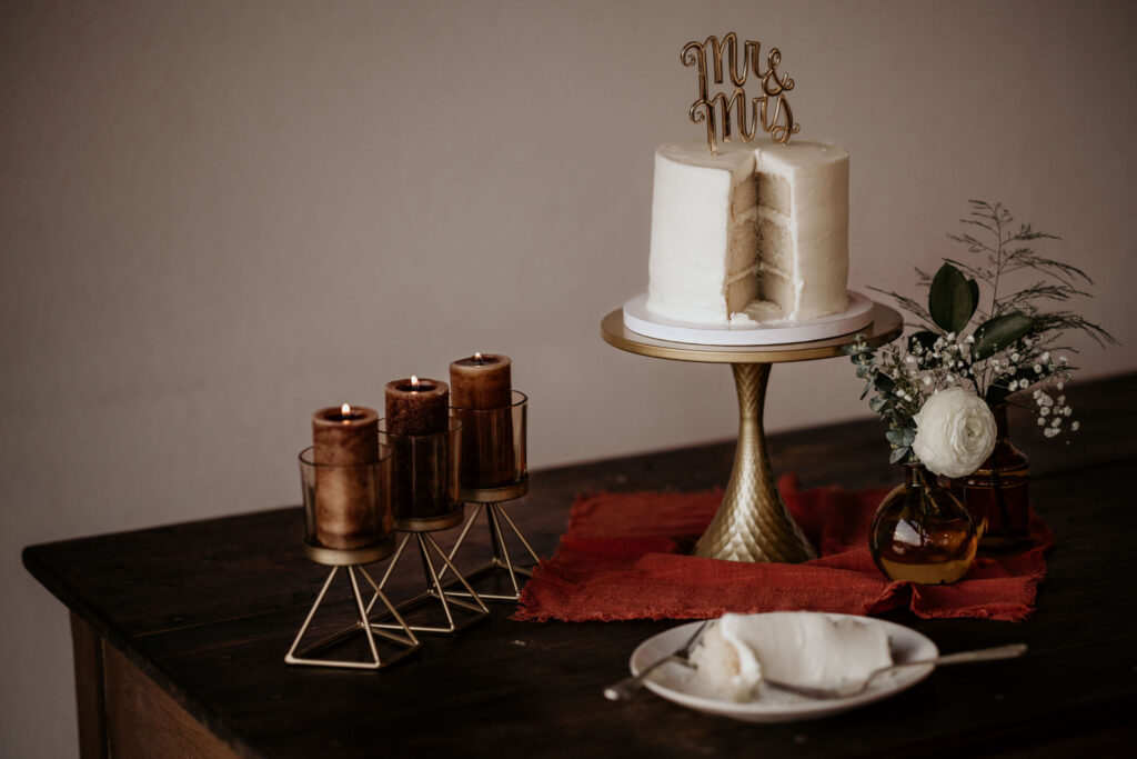 table has a small cake set up with decorations for a colorado micro wedding.