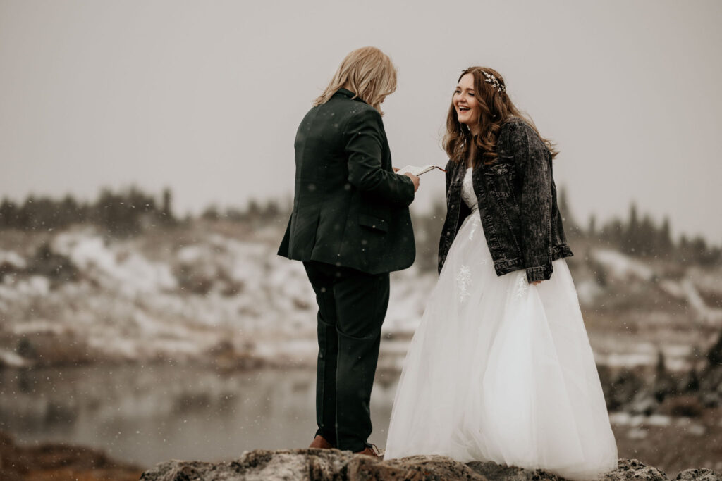 newlywed couple laugh during their breckenridge elopement ceremony.