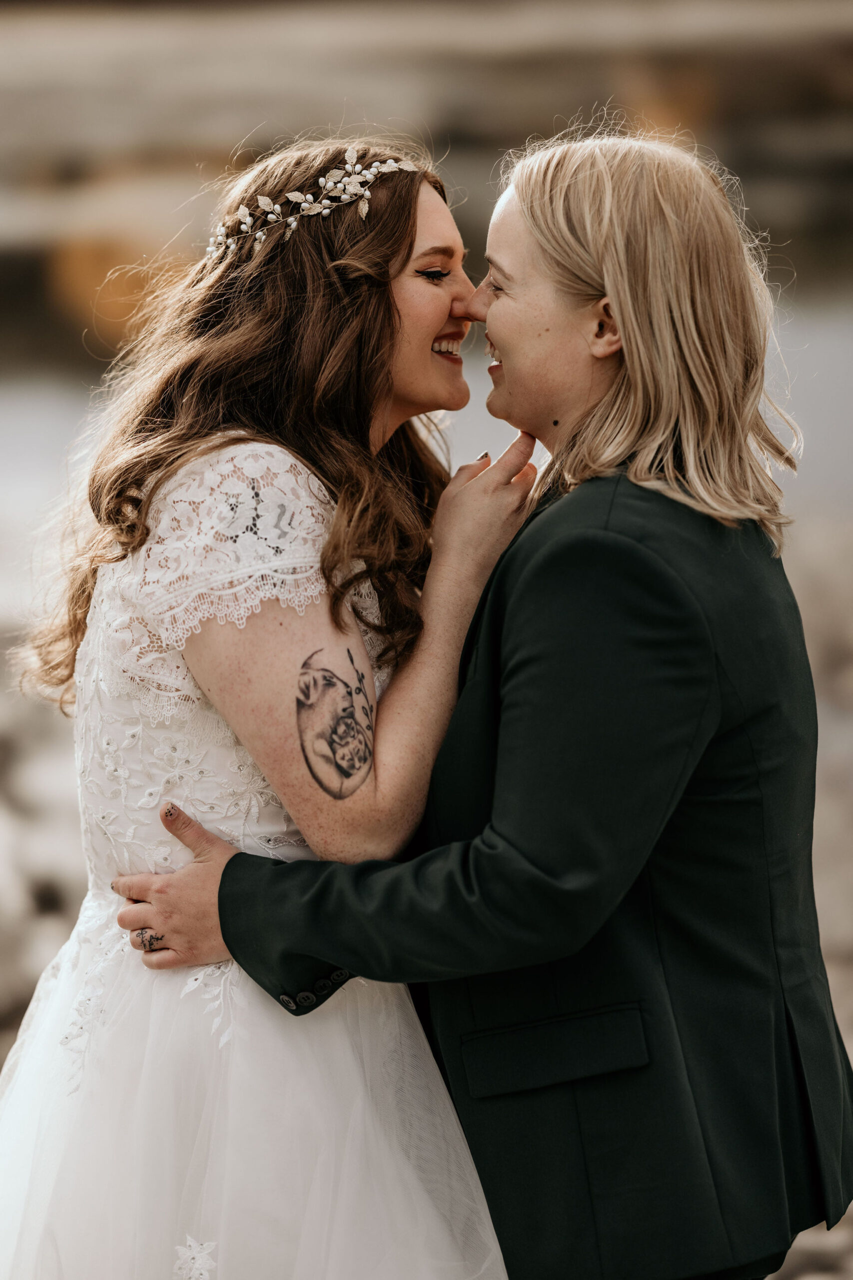 newlywed couple go in for a kiss during easygoing wedding portraits in breckenridge colorado.