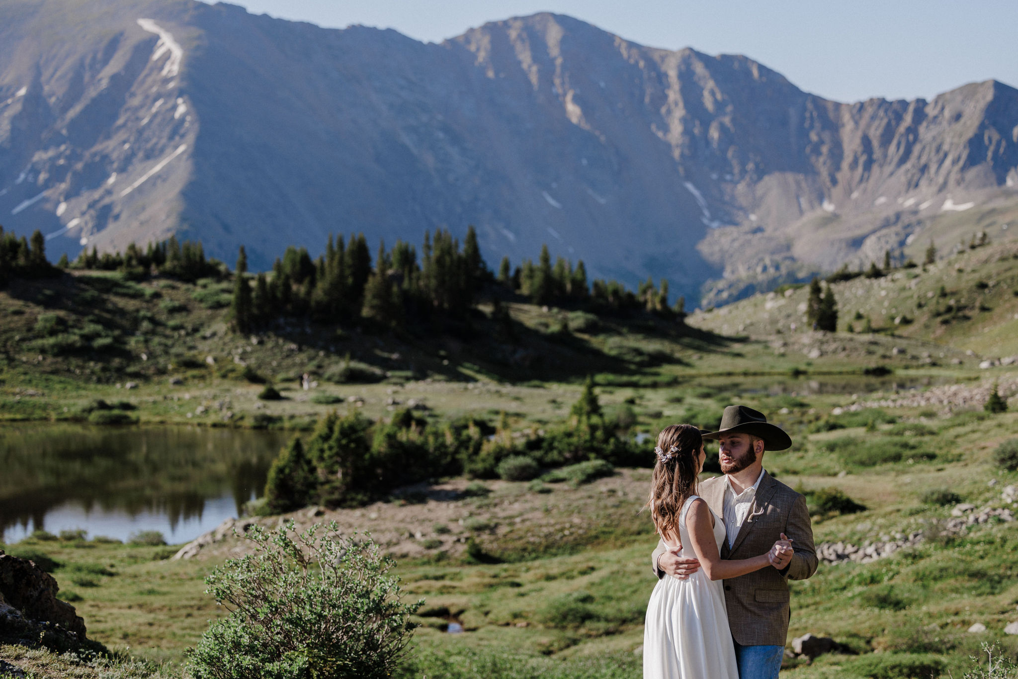 bride and groom dance at pass lake in breckenridge colorado