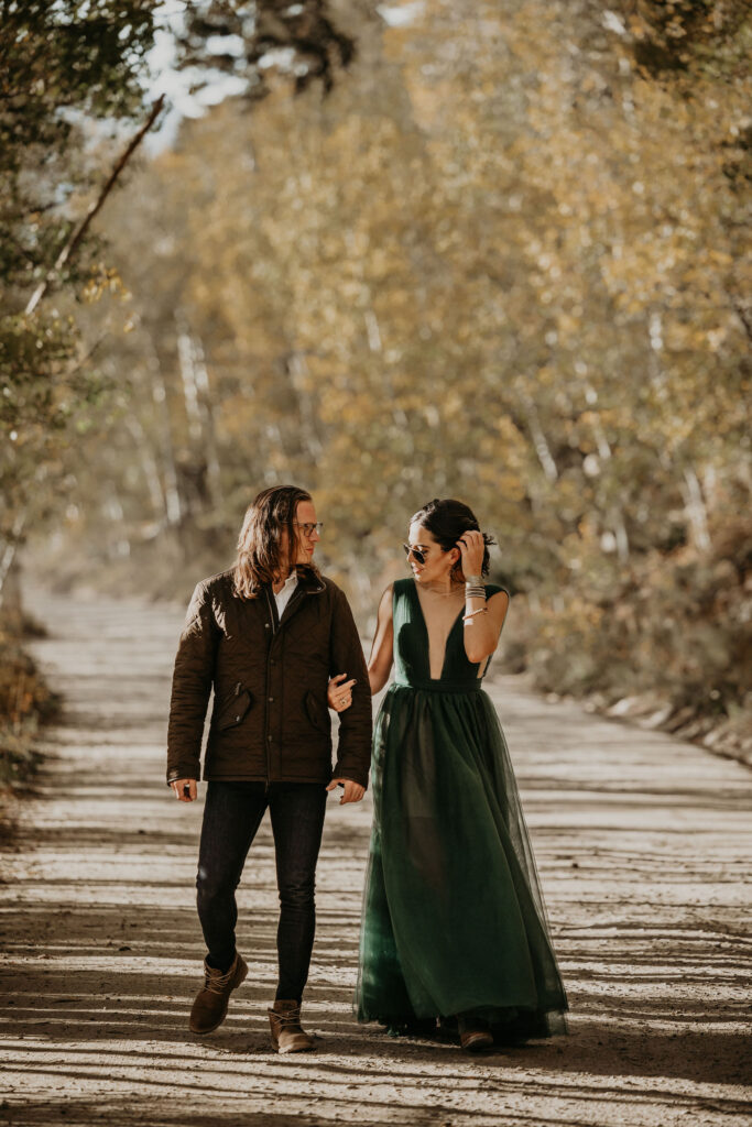 man and woman take engagement photos at boreas pass colorado.