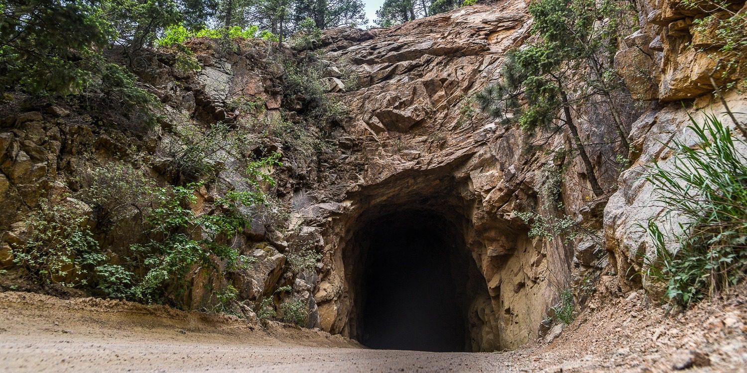 tunnel through rocks at colorado engagement photo location