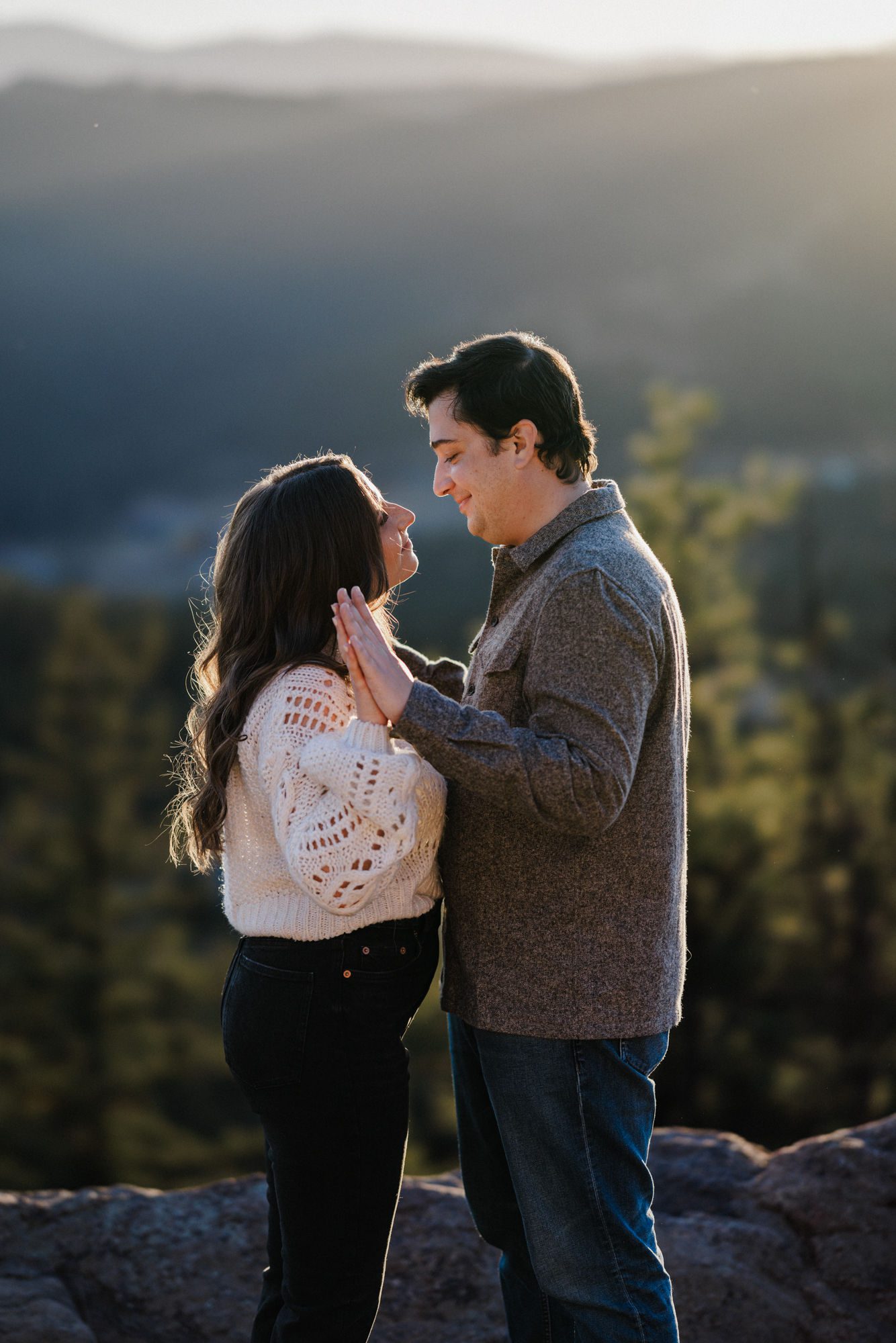 engaged couple poses for colorado engagement photographer