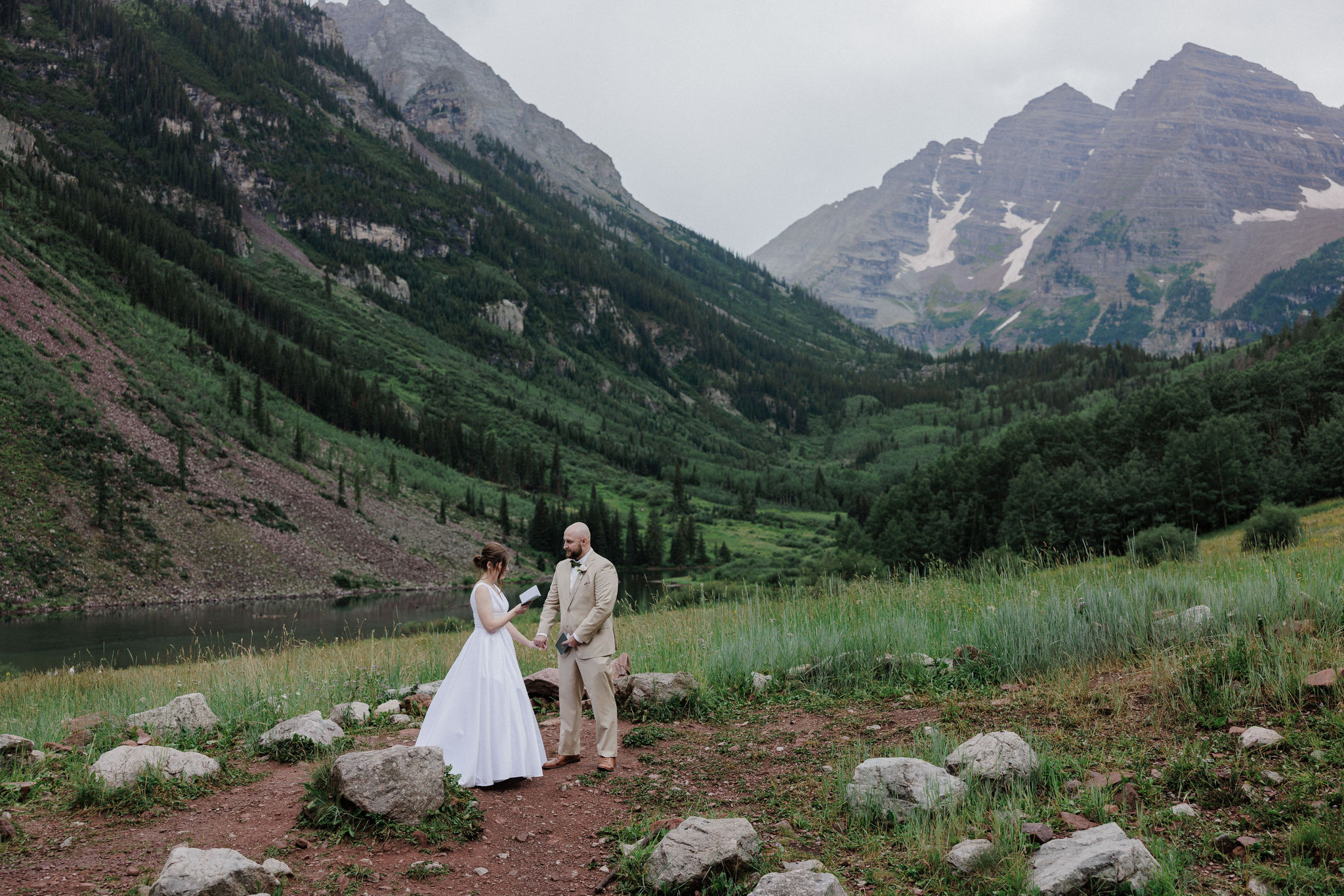 bride and groom say wedding vows at most popular colorado wedding location