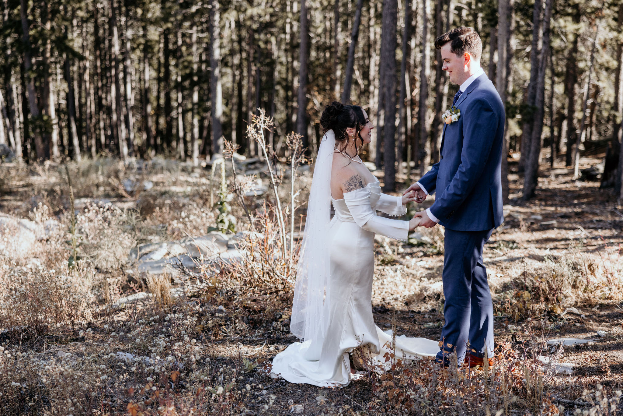 bride and groom pose for colorado micro wedding photographer.