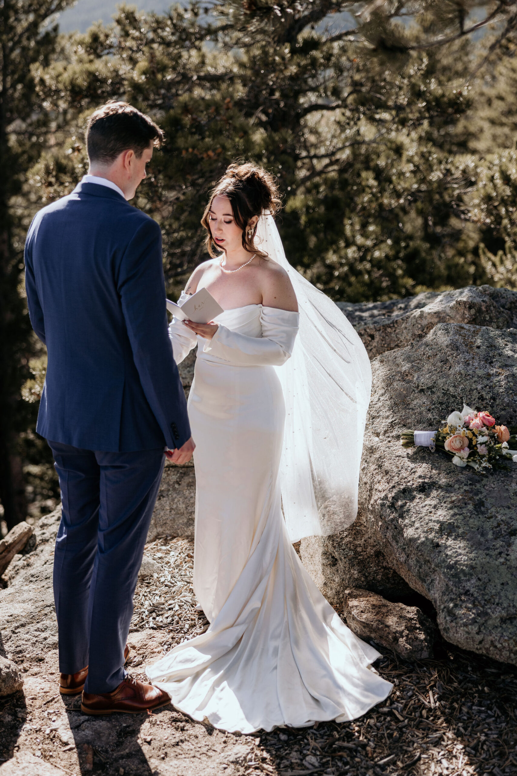 bride reads wedding vows during Airbnb elopement ceremony.
