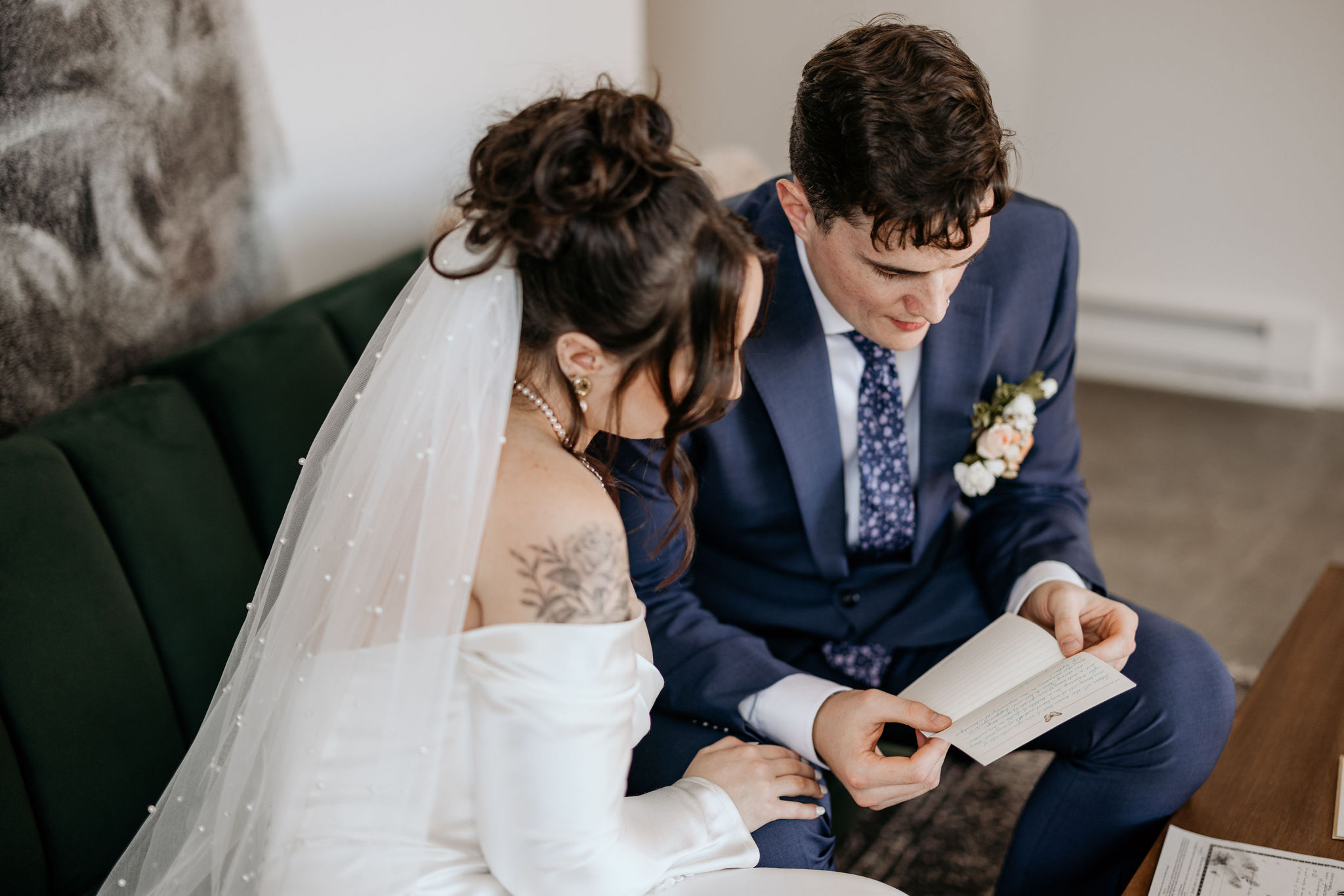 bride and groom read letters from family and friends during airbnb colorado elopement.