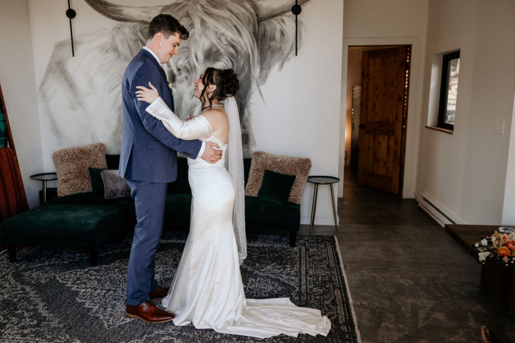 bride and groom dance in airbnb during colorado elopement.