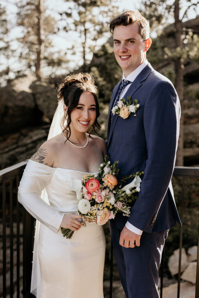 bride and groom pose for colorado elopement photographer.