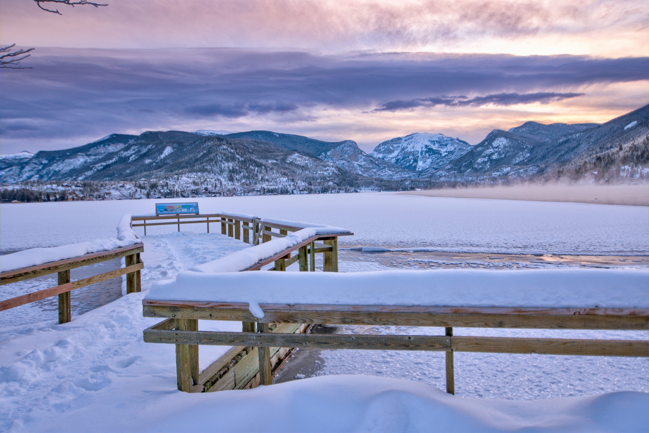 dock stretches over frozen lake in winter--colorado micro wedding and elopement location