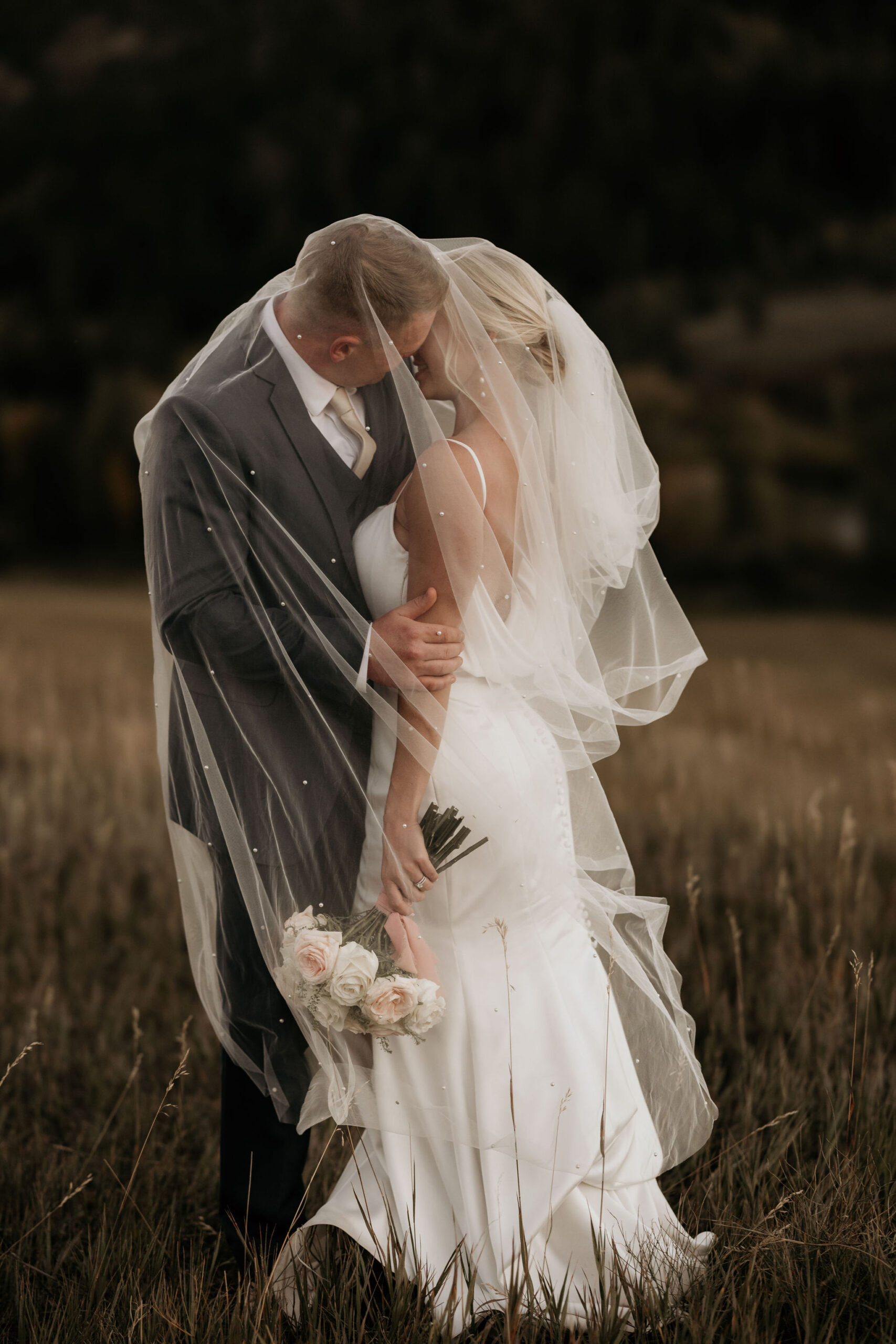 bride and groom pose for colorado wedding photographer during elopement.