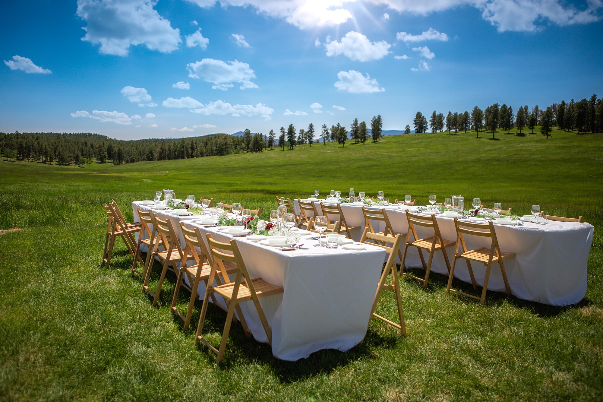 colorado airbnb/vrbo micro wedding venue - less than an hour from denver - family style table set up in the field