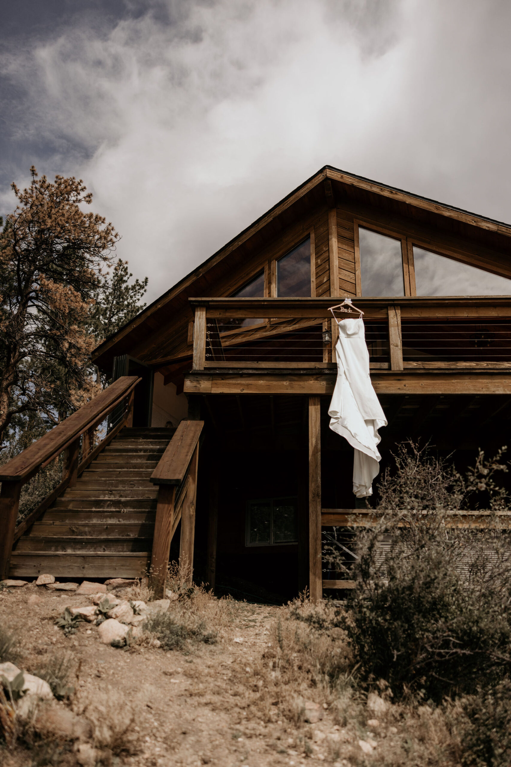 wedding dress hangs from colorado airbnb wedding venue.