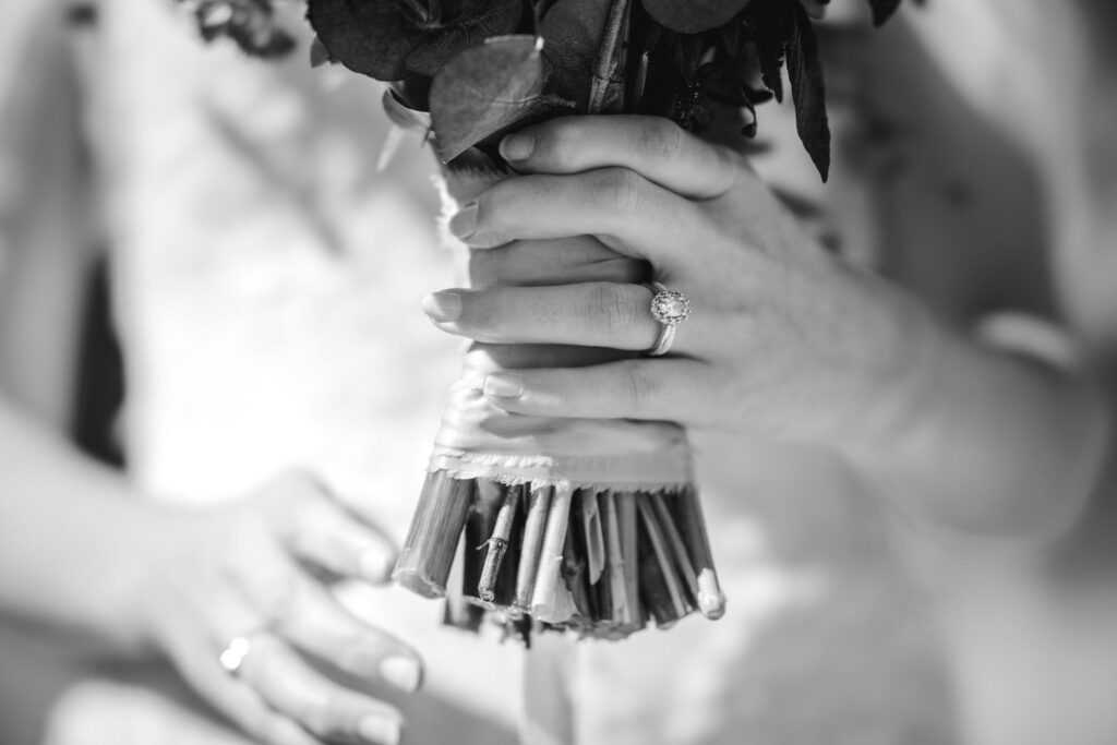 close up image of bride holding wedding florals.